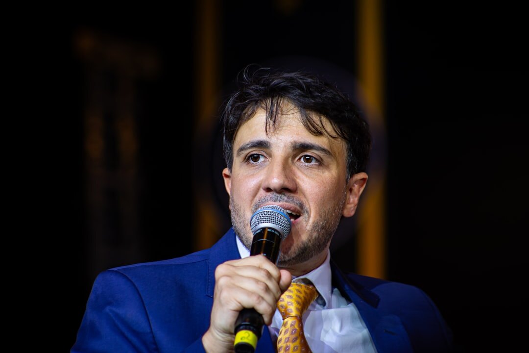 young person speaking at microphone